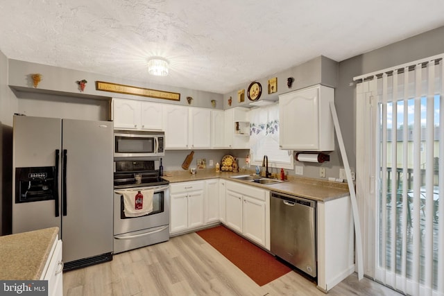 38 Bonniefield Cir, Gettysburg, PA 17325 - kitchen with appliances with stainless steel finishes, a sink, white cabinets, and healthy amount of natural light