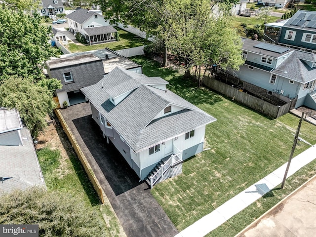 birds eye view of property with a residential view