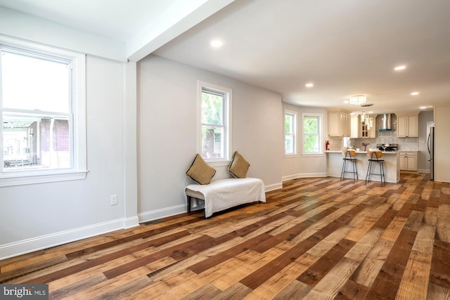 sitting room featuring recessed lighting, baseboards, and wood finished floors