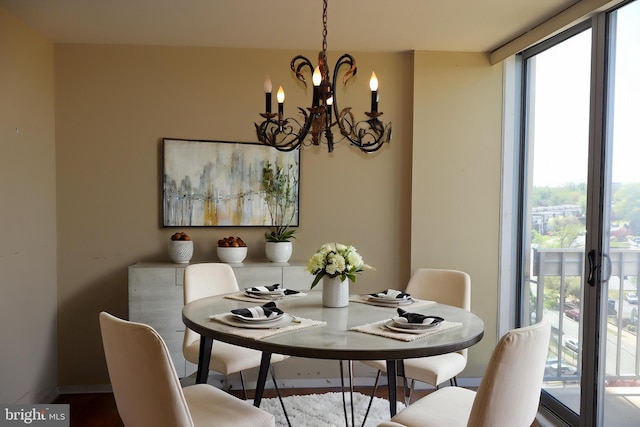 dining room with a notable chandelier