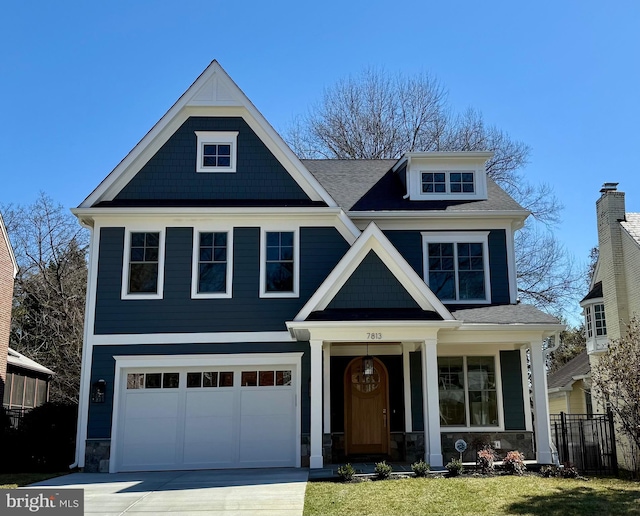 craftsman-style house featuring covered porch, driveway, a garage, fence, and stone siding