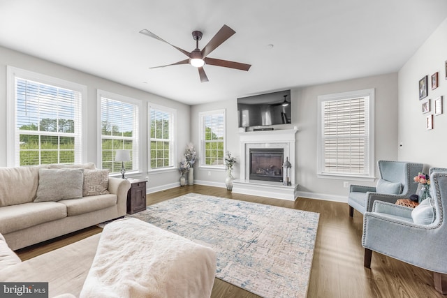 24083 Woodmore Dr, Hollywood, MD 20636 - living area featuring a ceiling fan, baseboards, wood finished floors, and a fireplace