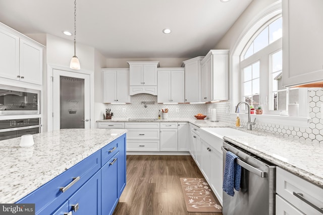 24083 Woodmore Dr, Hollywood, MD 20636 - kitchen with a sink, white cabinets, stainless steel appliances, and blue cabinets