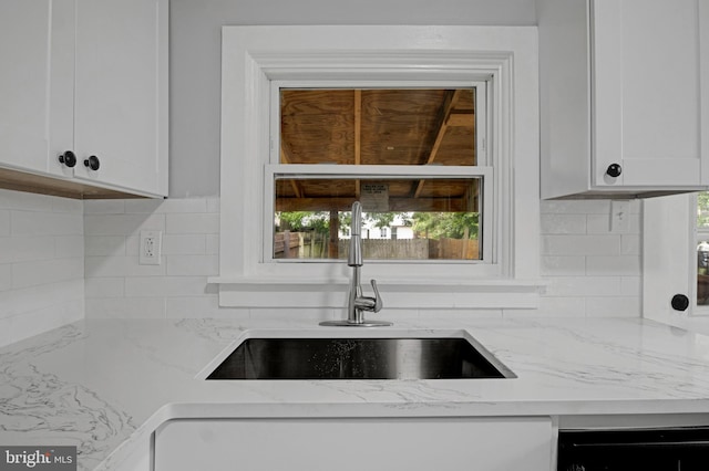 536 Lafayette St, Lancaster, PA 17603 - kitchen with a sink, white cabinetry, decorative backsplash, and light stone counters