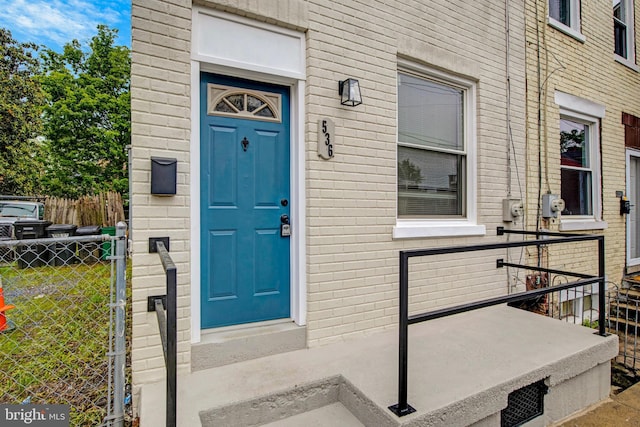 536 Lafayette St, Lancaster, PA 17603 - doorway to property with fence and brick siding