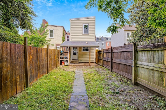 536 Lafayette St, Lancaster, PA 17603 - rear view of property with a fenced backyard and an outdoor structure