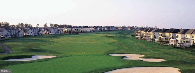 view of community with a residential view and view of golf course