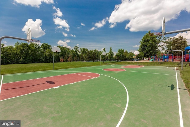 view of sport court with a lawn, community basketball court, and playground community