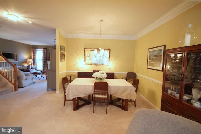 dining space with crown molding, stairs, light carpet, and an inviting chandelier