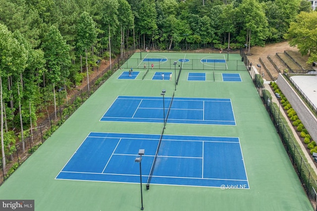 view of sport court with fence