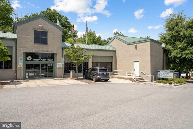 view of building exterior with driveway