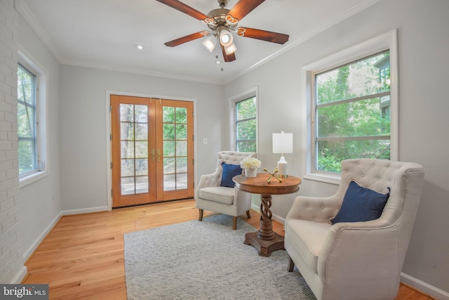 9709 W Bexhill Dr, Kensington, MD 20895 - sitting room featuring a ceiling fan, french doors, light wood-type flooring, baseboards, and ornamental molding