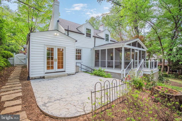 9709 W Bexhill Dr, Kensington, MD 20895 - rear view of property with roof with shingles, a chimney, a sunroom, a gate, and a patio area