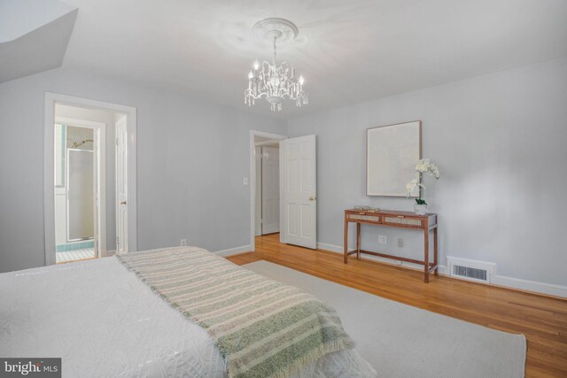 9709 W Bexhill Dr, Kensington, MD 20895 - bedroom featuring visible vents, baseboards, wood finished floors, and an inviting chandelier