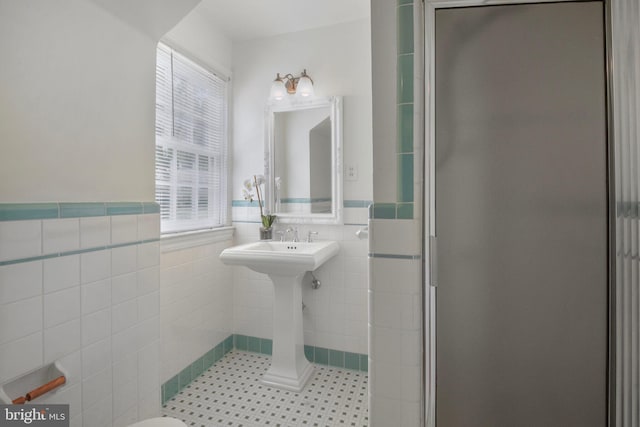 9709 W Bexhill Dr, Kensington, MD 20895 - bathroom featuring a wainscoted wall, a stall shower, and tile walls