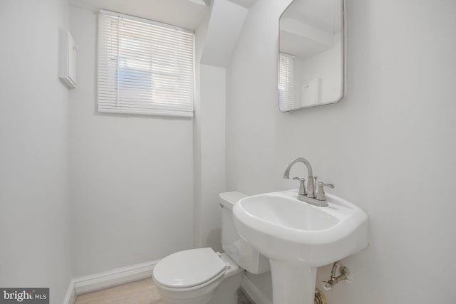9709 W Bexhill Dr, Kensington, MD 20895 - bathroom with toilet, baseboards, and a sink
