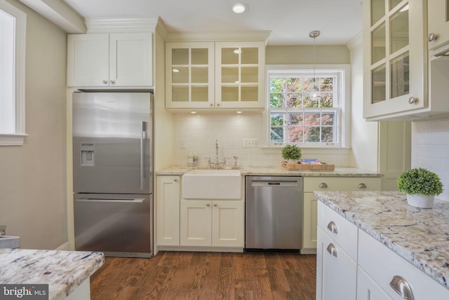 9709 W Bexhill Dr, Kensington, MD 20895 - kitchen with decorative backsplash, dark wood-style flooring, appliances with stainless steel finishes, a sink, and light stone counters