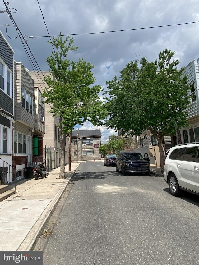 view of street featuring curbs and sidewalks