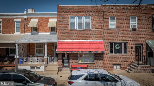 exterior space featuring brick siding