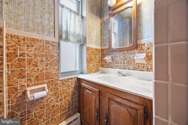 bathroom featuring vanity and tile walls