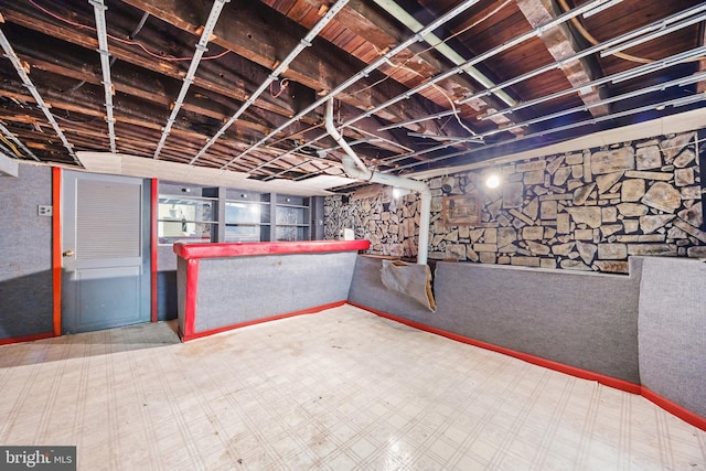unfinished basement featuring tile patterned floors