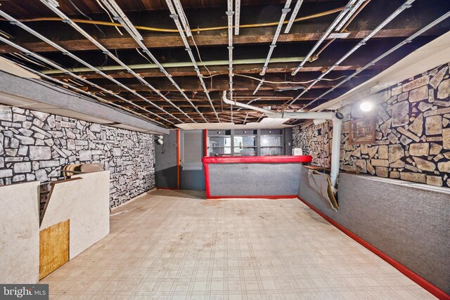 basement with tile patterned floors