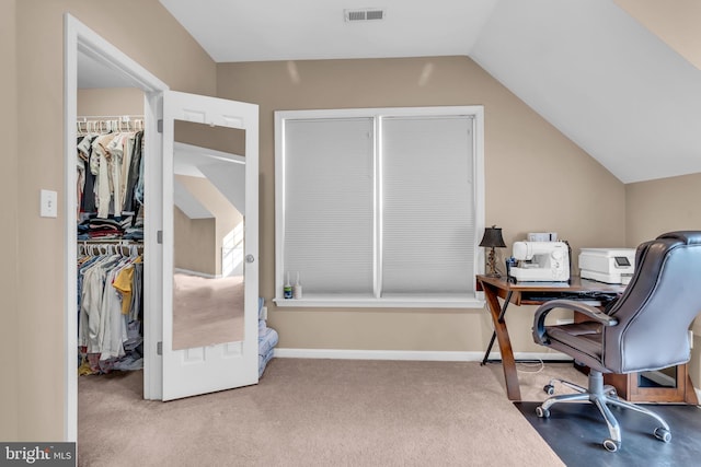 carpeted office with vaulted ceiling and visible vents