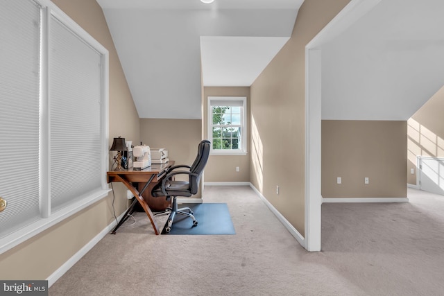 home office with vaulted ceiling, baseboards, and carpet floors