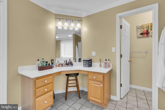 bathroom with tile patterned floors, baseboards, vanity, and crown molding