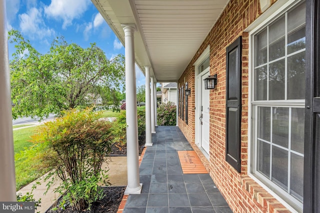 view of patio featuring a porch