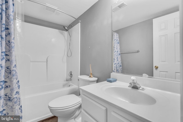 full bath with vanity, toilet, visible vents, and shower / bath combo
