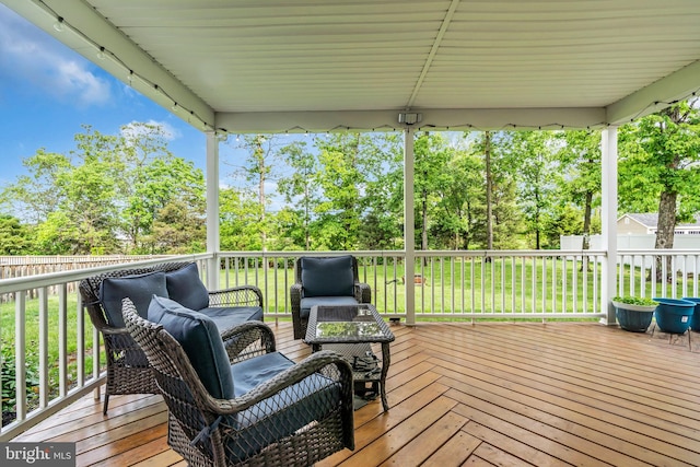 deck featuring a yard and fence