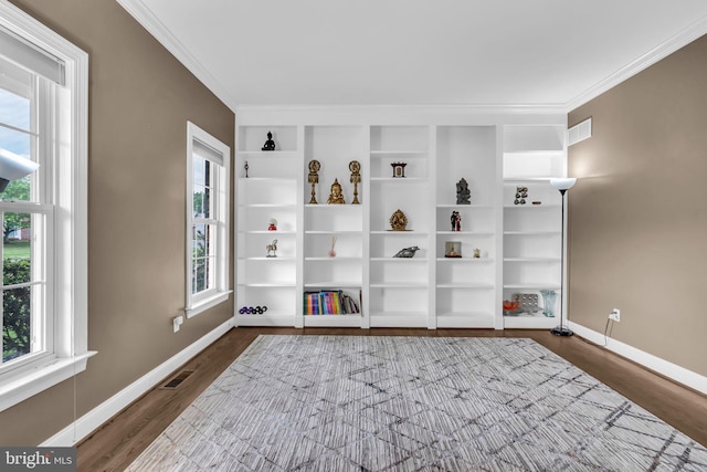 living area with crown molding, baseboards, visible vents, and dark wood finished floors