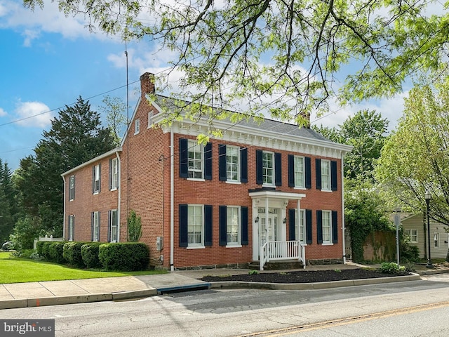 140 Pennsylvania Ave, Westminster, MD 21157 - view of front of home with brick siding and a chimney