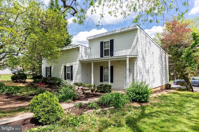 140 Pennsylvania Ave, Westminster, MD 21157 - traditional-style home with covered porch and a front yard