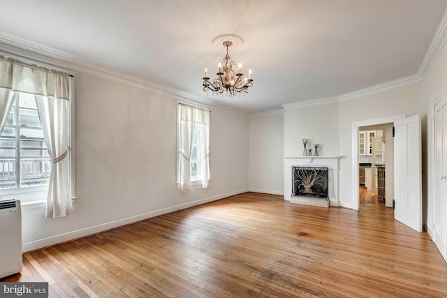 140 Pennsylvania Ave, Westminster, MD 21157 - unfurnished living room with a chandelier, light wood-style flooring, ornamental molding, and a premium fireplace