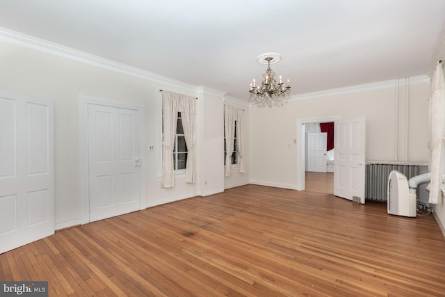 140 Pennsylvania Ave, Westminster, MD 21157 - unfurnished living room with a chandelier, crown molding, and light wood finished floors