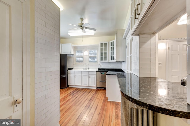 140 Pennsylvania Ave, Westminster, MD 21157 - kitchen featuring freestanding refrigerator, light wood-style flooring, white cabinets, ceiling fan, and glass insert cabinets