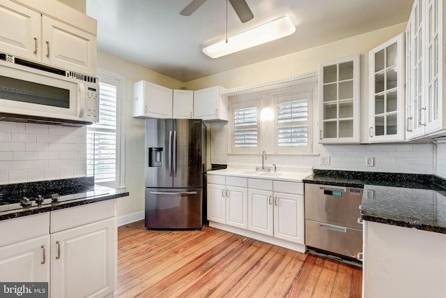 140 Pennsylvania Ave, Westminster, MD 21157 - kitchen featuring appliances with stainless steel finishes, ceiling fan, light wood finished floors, and backsplash