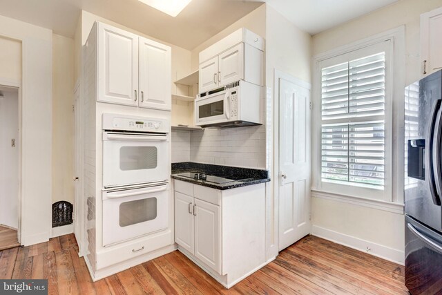 140 Pennsylvania Ave, Westminster, MD 21157 - kitchen featuring white appliances, light wood-type flooring, decorative backsplash, white cabinets, and open shelves