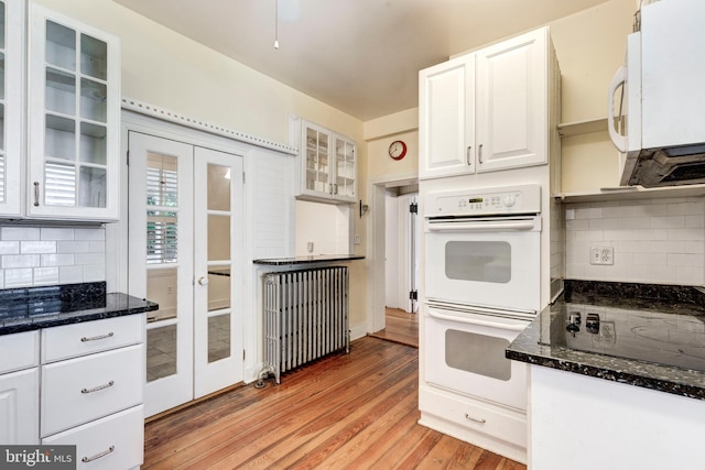 140 Pennsylvania Ave, Westminster, MD 21157 - kitchen with white appliances, decorative backsplash, white cabinets, and french doors