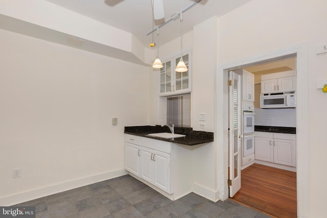 140 Pennsylvania Ave, Westminster, MD 21157 - kitchen featuring white appliances, white cabinetry, backsplash, glass insert cabinets, and a ceiling fan