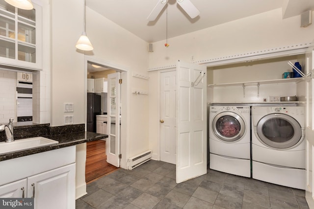 140 Pennsylvania Ave, Westminster, MD 21157 - washroom with a baseboard radiator, separate washer and dryer, and ceiling fan