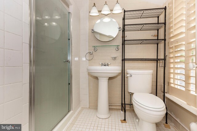 140 Pennsylvania Ave, Westminster, MD 21157 - bathroom featuring a shower stall, tile patterned flooring, and tile walls