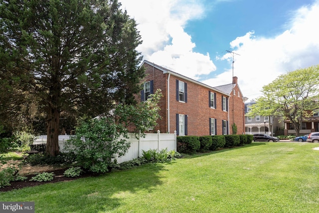 140 Pennsylvania Ave, Westminster, MD 21157 - view of side of property featuring brick siding and a yard