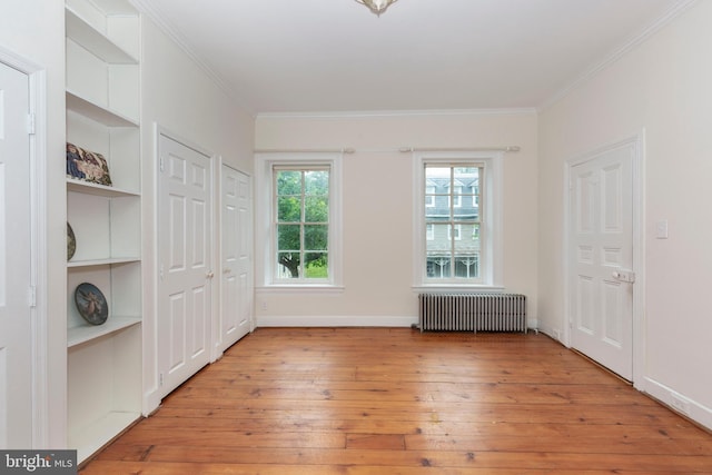 140 Pennsylvania Ave, Westminster, MD 21157 - unfurnished bedroom with radiator, light wood finished floors, and ornamental molding