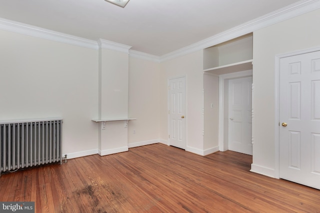 140 Pennsylvania Ave, Westminster, MD 21157 - unfurnished bedroom with radiator, ornamental molding, and wood finished floors