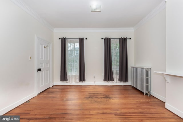 140 Pennsylvania Ave, Westminster, MD 21157 - spare room with radiator, ornamental molding, and wood finished floors