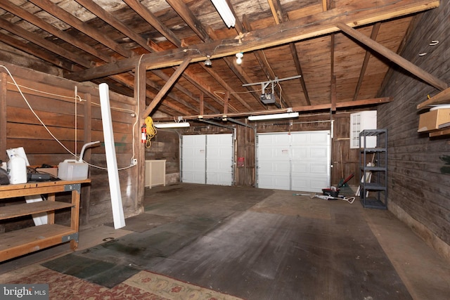 140 Pennsylvania Ave, Westminster, MD 21157 - garage featuring a garage door opener and wooden walls