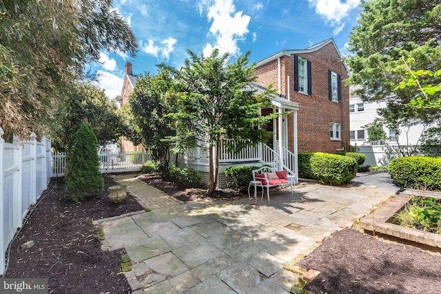 140 Pennsylvania Ave, Westminster, MD 21157 - rear view of house featuring brick siding and a patio area